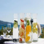 Glass-carafe-with-white-lid.webp