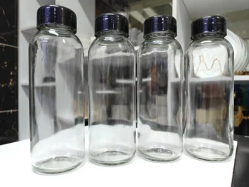 Reusable glass juice bottles